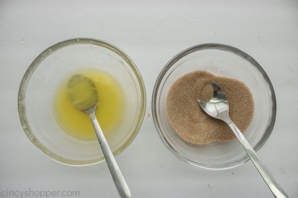 Bowl with melted butter and bowl with cinnamon sugar