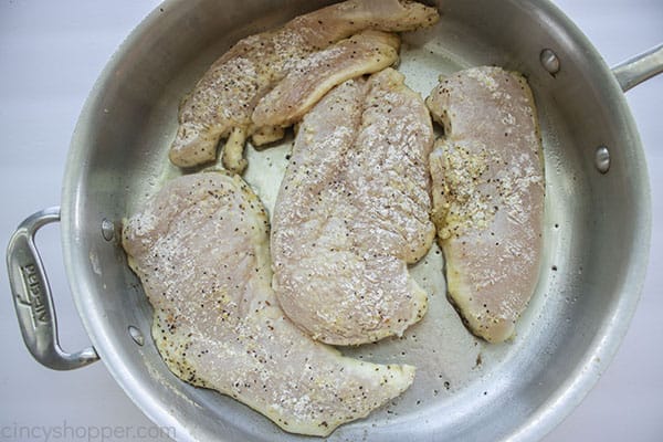 Coated chicken in pan