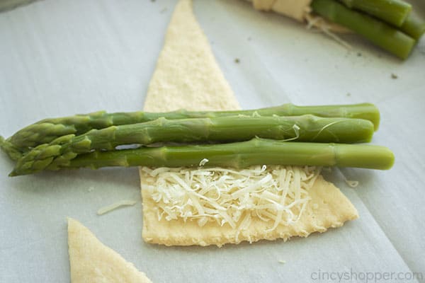 Asparagus added to the top of cheese
