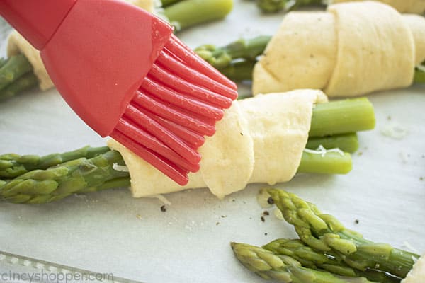 Garlic butter added to crescent roll