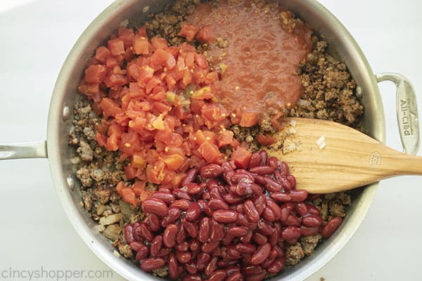 Beans, tomatoes and sauce added to ground beef