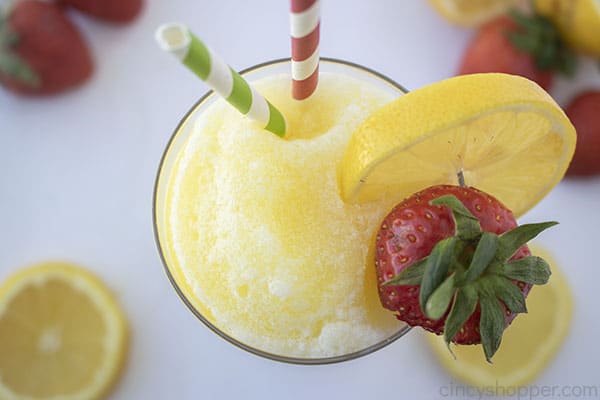 Frozen lemonade with fresh lemon and strawberries