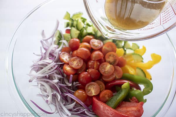 Greek dressing added to salad