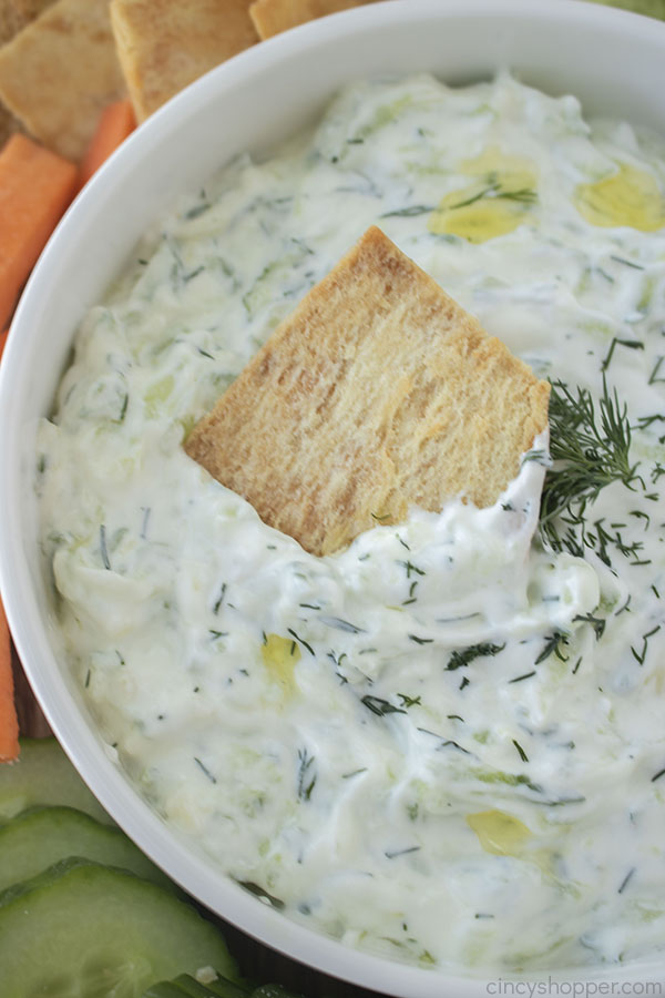 Greek Tzatziki Sauce in a bowl with pita chip