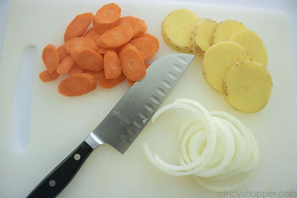 Sliced carrots, potatoes, and onions.