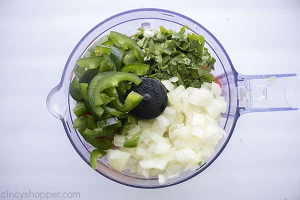 Herbs, pepper and onion added to tomatoes