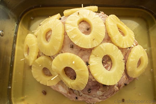Baked ham with pineapple in a pan