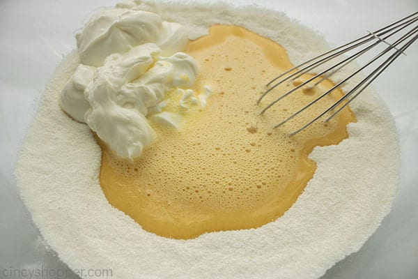 Eggs and sour cream added to dry ingredients