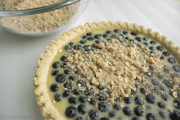 Adding crumble to blueberry pie