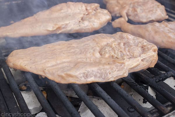 Chicken with ranch and barbeque on the grill