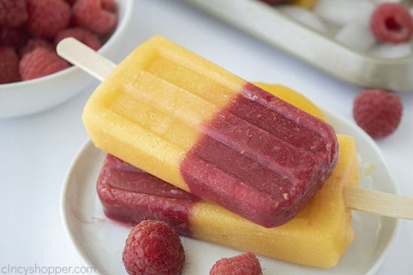 stack of popsicles made with berries and peaches