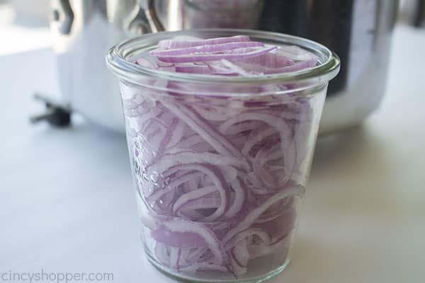 Raw red onion in jar