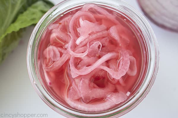 Red onions pickled in a jar