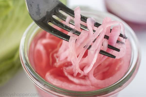 Marinated onions on a fork