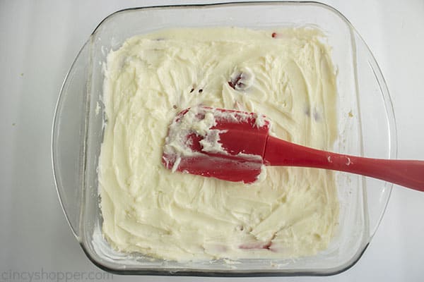 Cream cheese mixture added to the top of strawberries