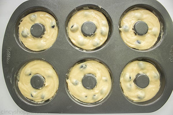 Donut batter in pan with blueberries