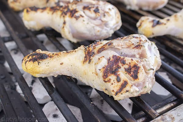 Seared chicken leg on grill