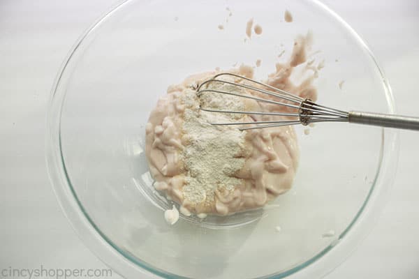 Strawberry yogurt and cheesecake pudding in a bowl