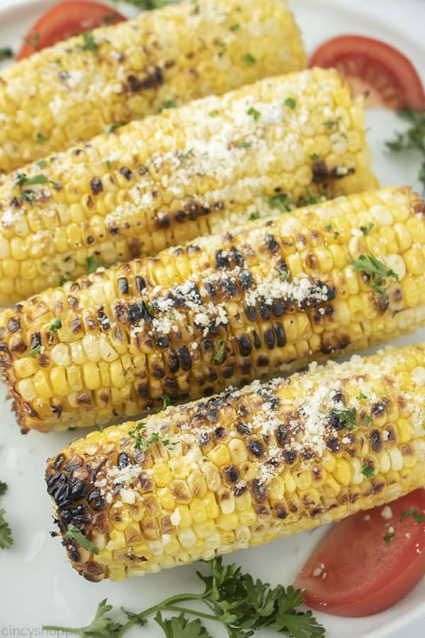 Fresh grilled corn with Parmesan on a plate