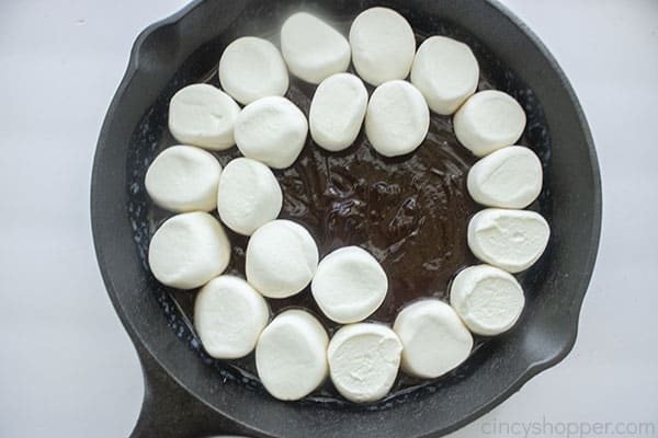 Marshmallows added to chocolate in pan