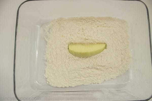 Apple wedge in flour and sugar mixture