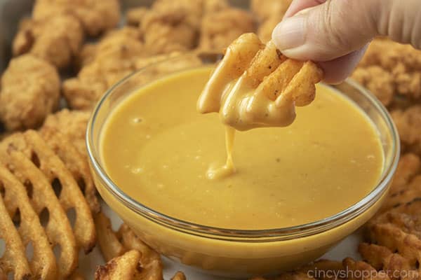 Waffle fry dipping in CopyCat Chick-fil-A Sauce