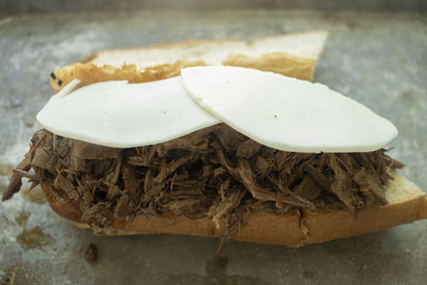 Shredded beef on roll with cheese