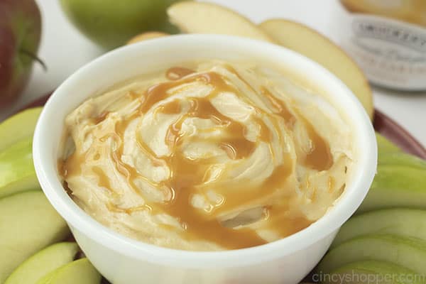 Cream cheese apple dip with caramel in a bowl