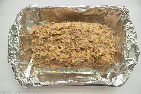 Uncooked meatloaf in a baking dish