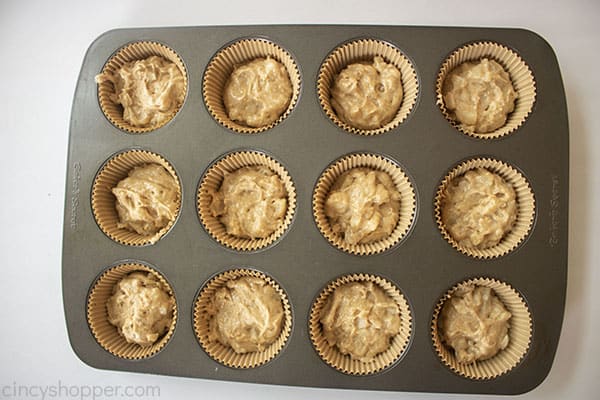 Apple cake batter added to cupcake liners