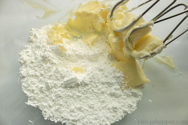 Powdered sugar added to creamed butter