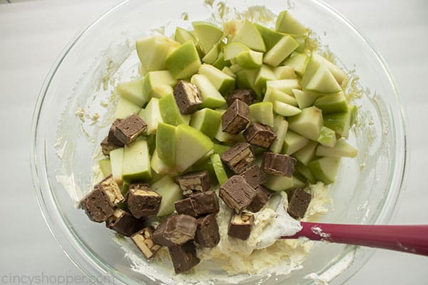 Apples and candy bars added to mixture