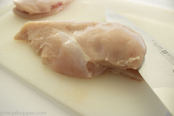Slicing chicken breast in half