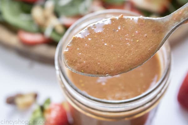 Strawberry salad dressing on a spoon