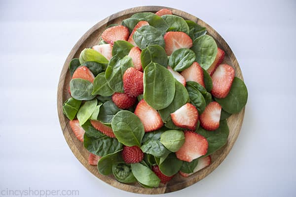 Strawberries added to salad