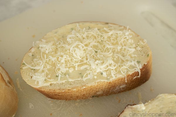 Cheese added to garlic bread