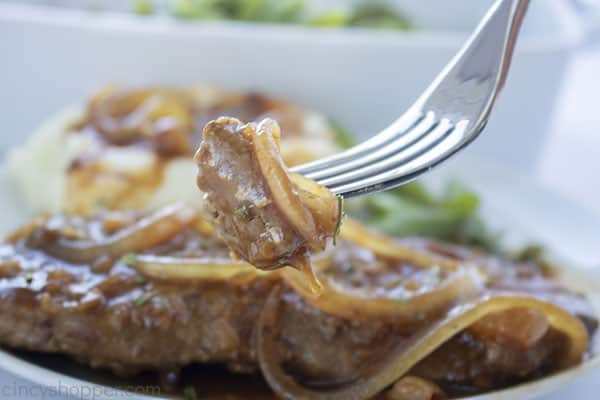 Fork with cube steak, onions and gravy