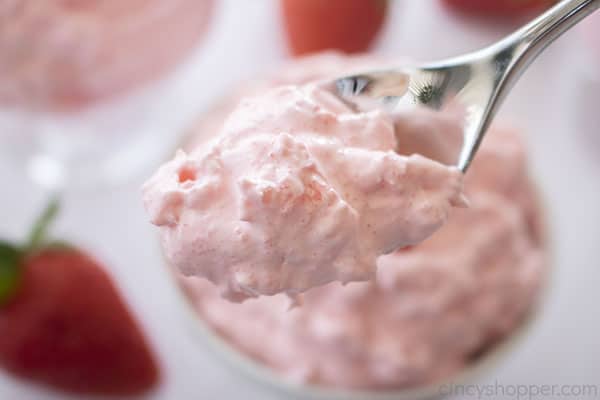 Jello Salad with cottage cheese on a spoon