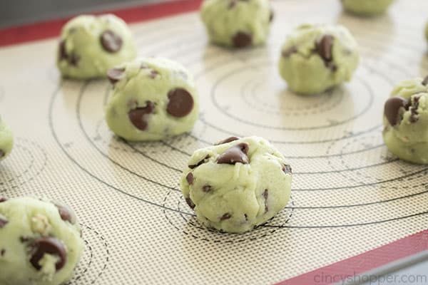 Mint cookie dough balls on cookie sheet