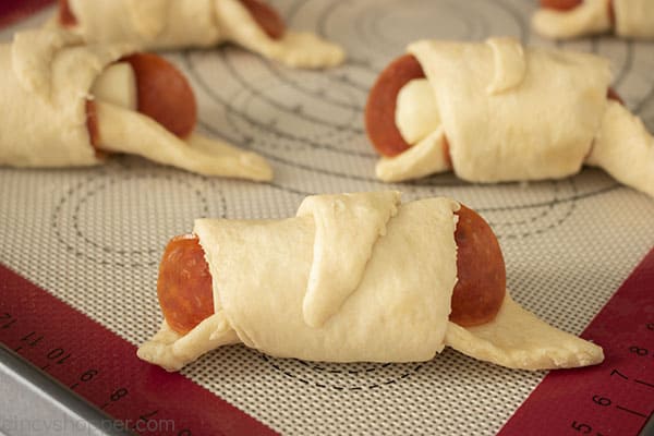 Folded Pepperoni Pizza Crescents on a pan