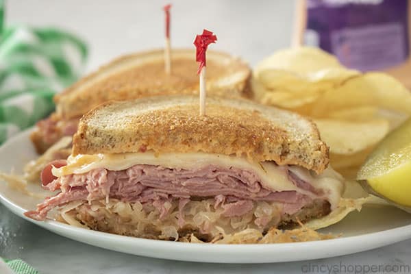 Finished reuben deli sandwich on a plate