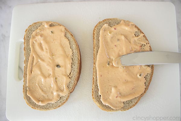 Adding dressing to bread