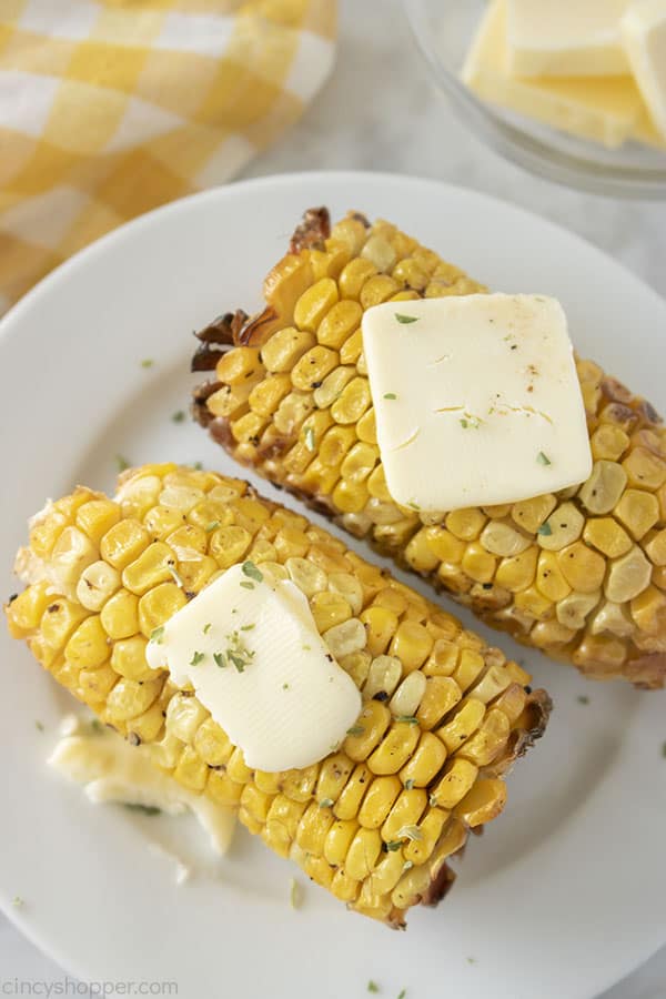 Air fried corn on the cob with butter on a plate