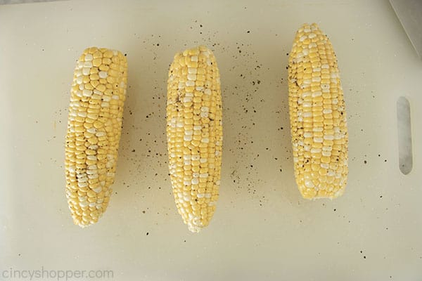 Corn cobs with oil salt and pepper