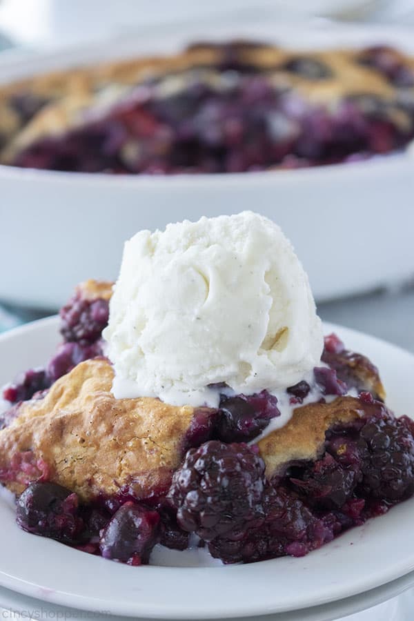 Easy Berry Cobbler on a plate with ice cream