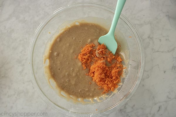 Adding the carrots to cupcake batter