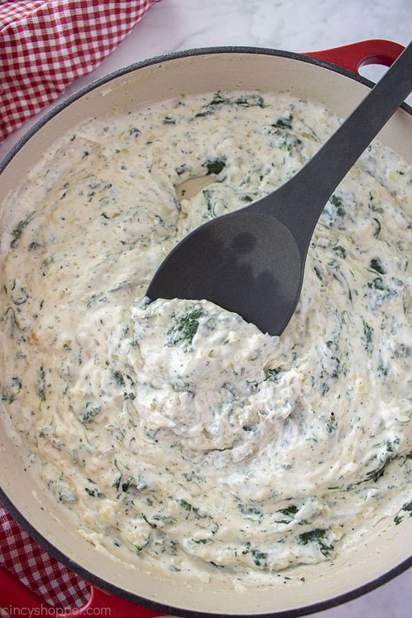 Creamed Spinach on a black spoon