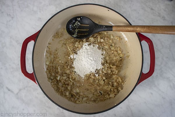Flour and seasonings added to pan