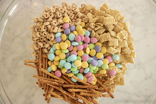 Cereal, pretzels, m&m's in a bowl