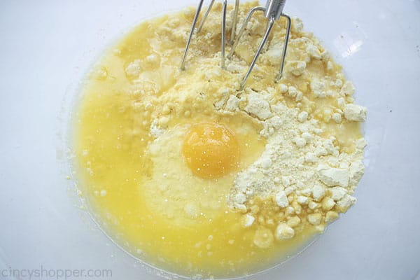 Eggs, cake mix, and butter in a bowl